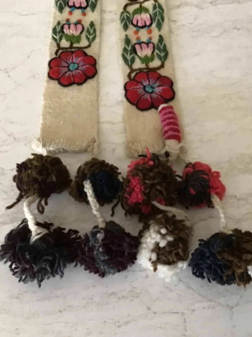 Embroidered belt with Pom poms